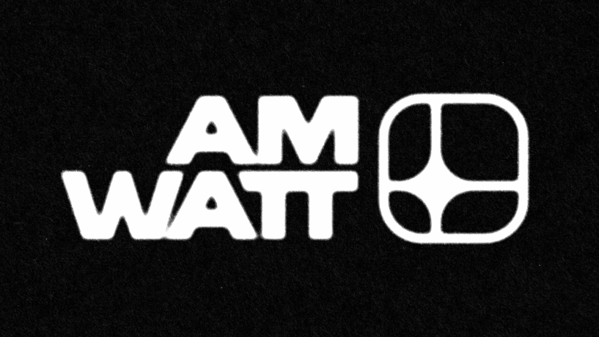 AM Watt embroidered logo on black fabric