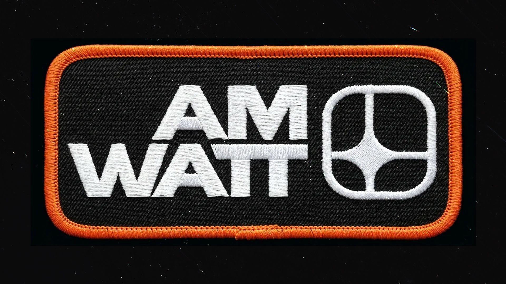 AM Watt embroidered patch with orange border on black