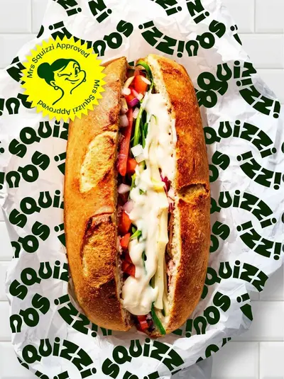 Squizzi olive oil sub roll on branded wrapper with approval sticker – squizzi