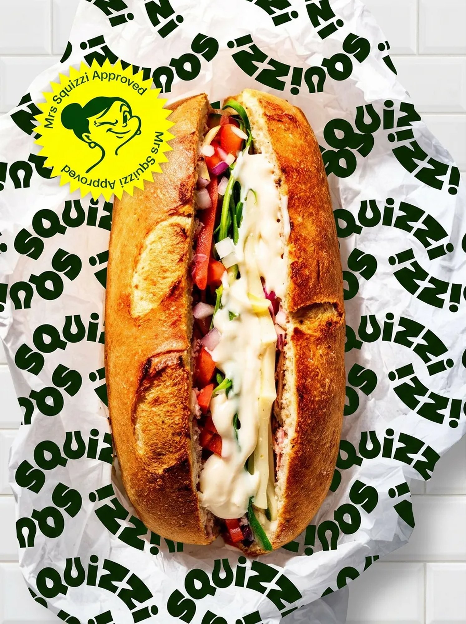 Squizzi olive oil sub roll on branded wrapper with approval sticker