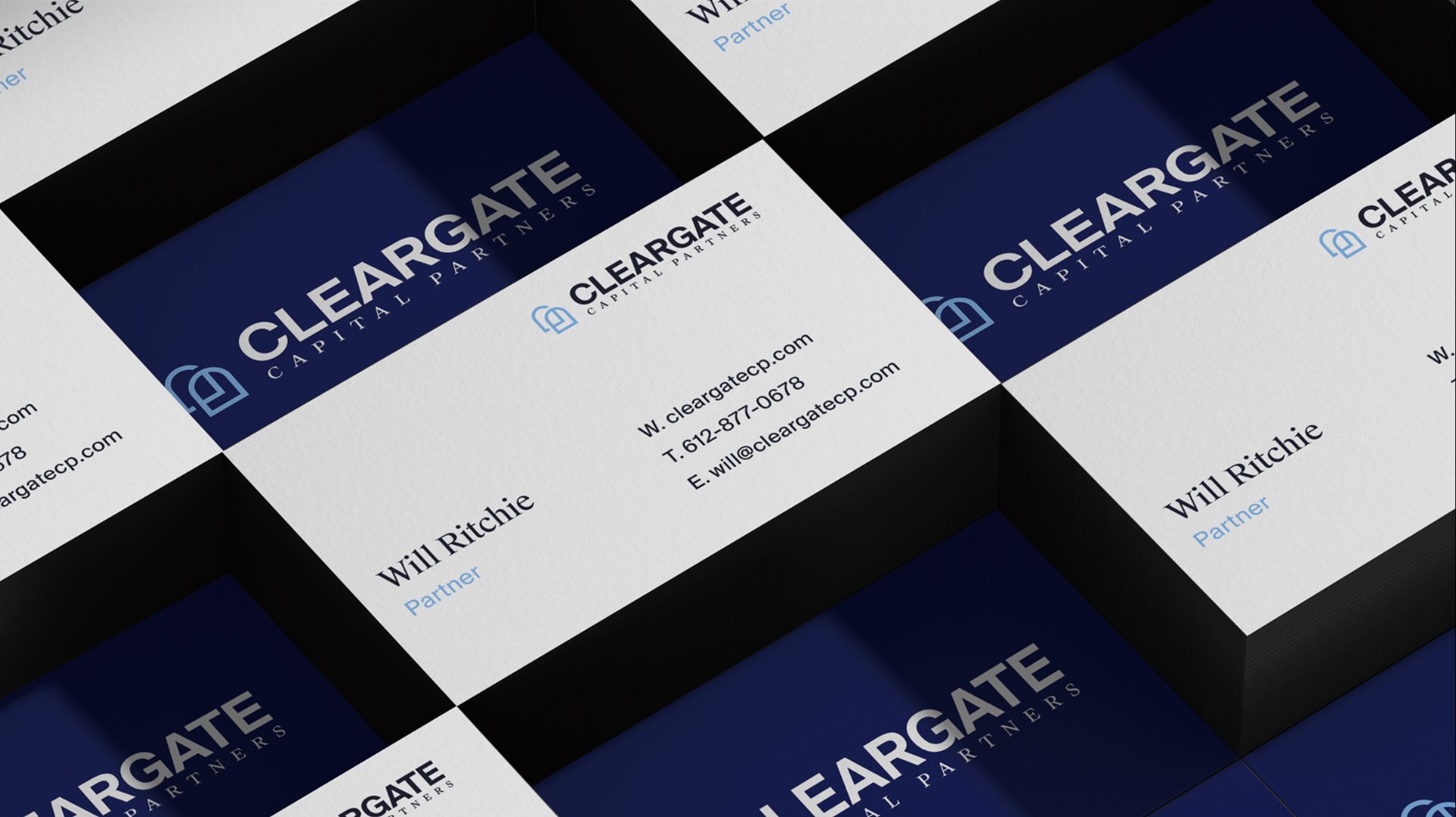 Angled grid of stacked Cleargate business cards alternating navy and white