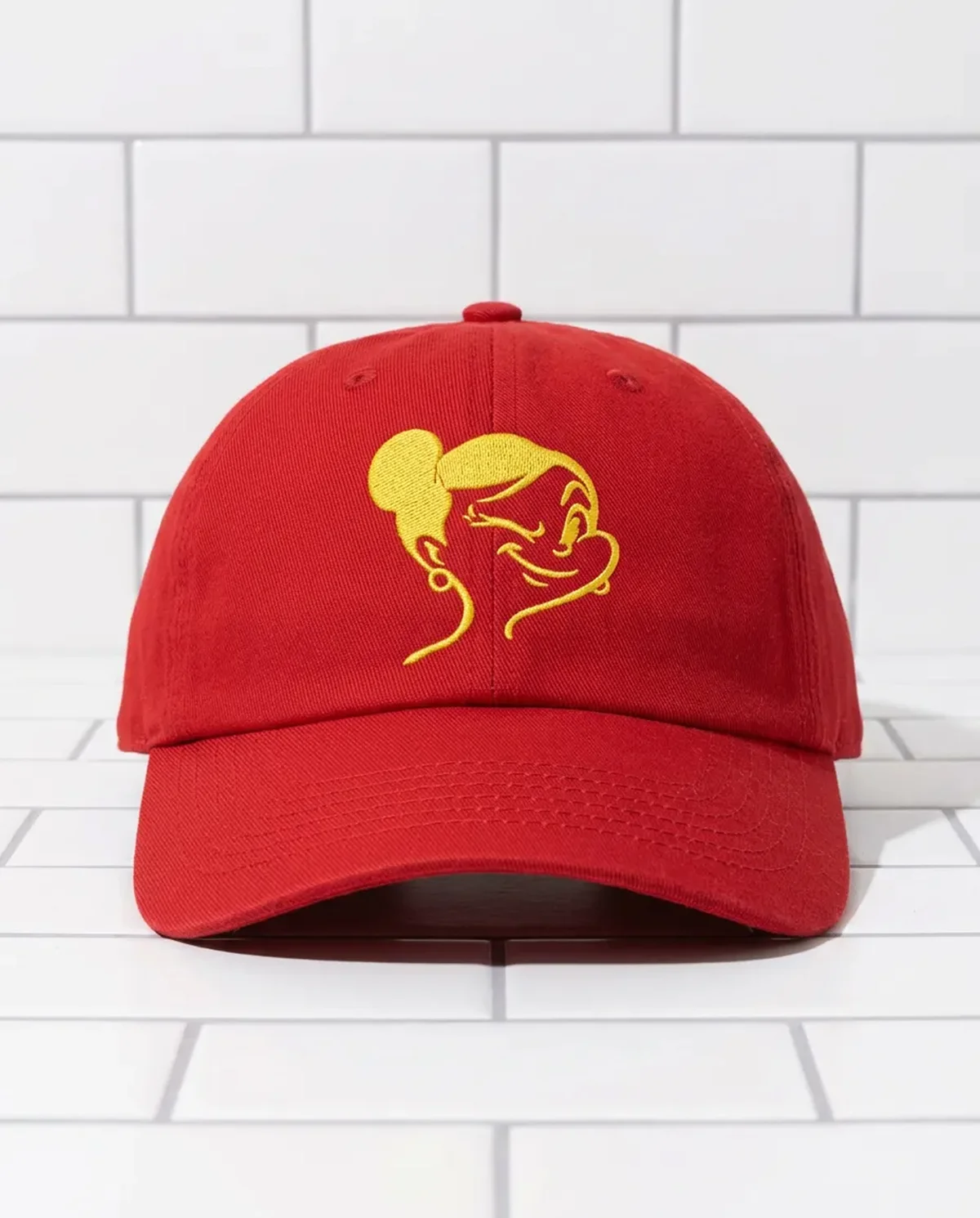 squizzi – Red cap embroidered with the yellow Mrs Squizzi face logo